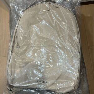 NWT ATHLETA ALL ABOUT BACKPACK cream BackPack Beige pockets water repellent